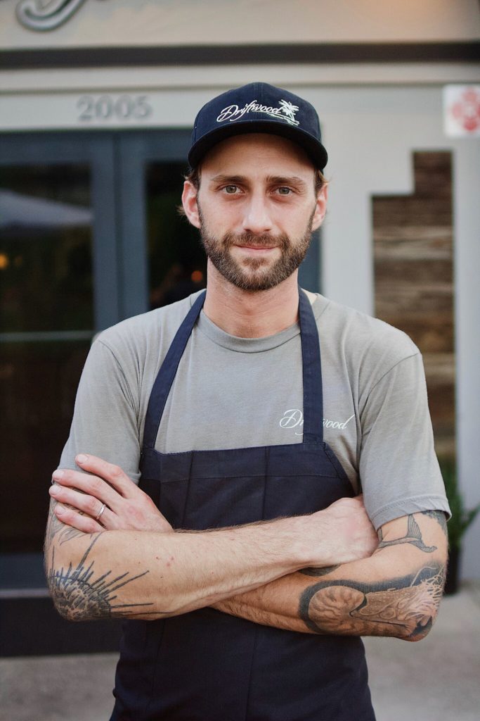 Photo portrait of Chef and Owner Jimmy Everett standing in front of the restaurant location.